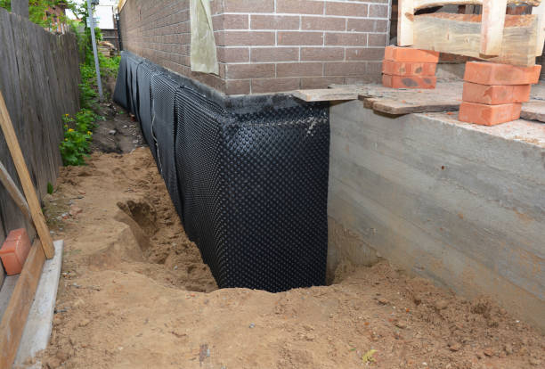 SJ Waterproofing Pros technician performing targeted Foundation Crack Repair assessment in Circle Pines, MN